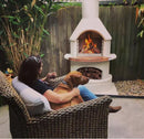 Buschbeck Rondo 3-in-1 Outdoor Fireplace outside while relaxing with its fire