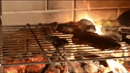 grilling inside a Buschbeck St Moritz 3-in-1 Outdoor Fireplace