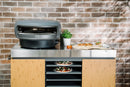 Everdure Pizza Station with pizzas and oven