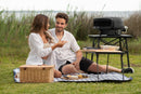 Everdure Kiln P Portable Series Pizza Oven is being used during picnic