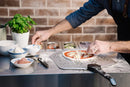 Everdure Pizza Station preparing pizza on top
