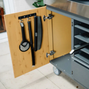 Everdure Pizza Oven Brush hanging in the kitchen cabinet