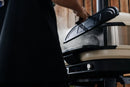 a person using gozney dome gen 2 door