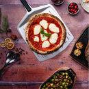Ooni 14” Perforated Peel with pizza on top