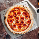 Ooni 14” Perforated Peel with pizza on top