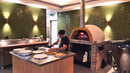 Ligurian - Commercial Pizza Oven being used in the kitchen while preparing pizzas